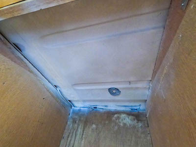 Interior of cupboard with exposed van roof