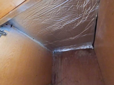 Interior of cupboard with vapour barrier added to exposed roof